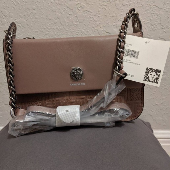 Anne Klein Handbags - NWT Anne Klein Lilac Emboss Lion Xbody Purse